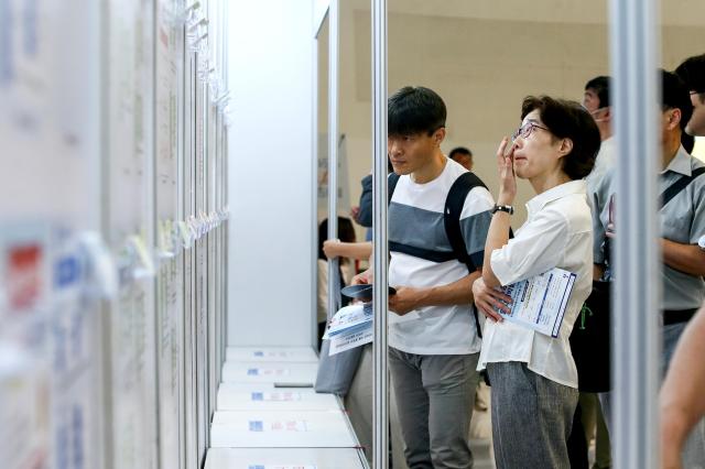 Visitors check the job postings at the 4050 Job Fair at Dongdaemun Design Plaza in Seoul on July 22 2024 AJU PRESS Kim Dong-woo