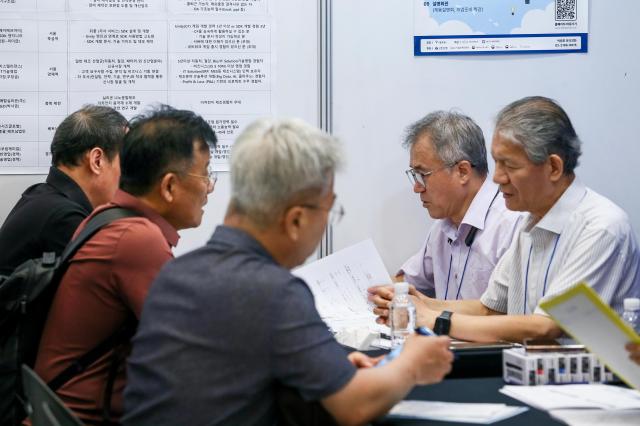 Visitors converse about careers at the 4050 Job Fair at Dongdaemun Design Plaza in Seoul on July 22 2024 AJU PRESS Kim Dong-woo