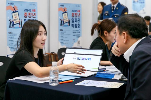 A visitor converse about careers at the 4050 Job Fair at Dongdaemun Design Plaza in Seoul on July 22 2024 AJU PRESS Kim Dong-woo