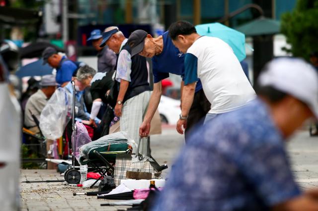 Senior citizens queue to receive free meals at Pagoda Park in Jongno-gu Seoul on July 23 2024 AJU PRESS Kim Dong-woo