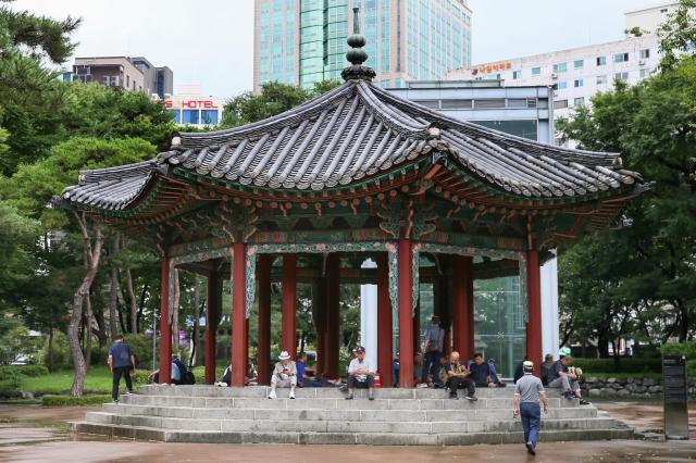 Senior citizens sit in an octagonal pavilion at Pagoda Park in Jongno-gu Seoul on July 23 2024 AJU PRESS Kim Dong-woo