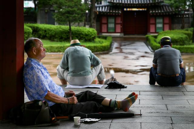 Senior citizens sit in an octagonal pavilion at Pagoda Park in Jongno-gu Seoul on July 23 2024 AJU PRESS Kim Dong-woo