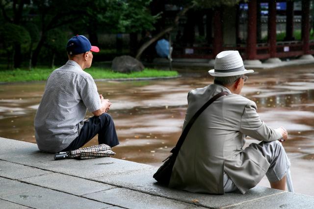 Senior citizens sit in an octagonal pavilion at Pagoda Park in Jongno-gu Seoul on July 23 2024 AJU PRESS Kim Dong-woo