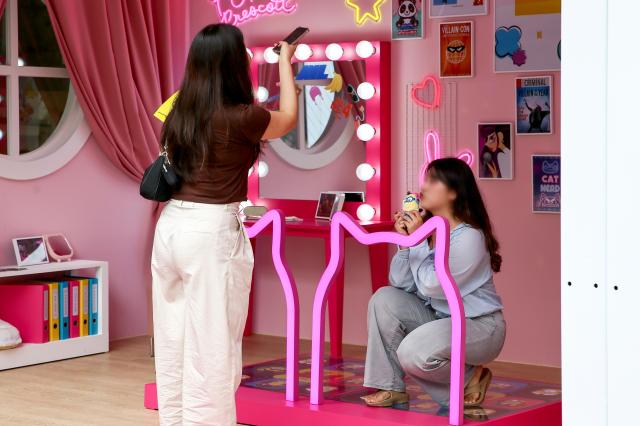 Visitors take a photo at the Design Vibes A Despicable Me Summer Vacation at Dongdaemun Design Plaza in Seoul on July 24 2024 AJU PRESS Kim Dong-woo