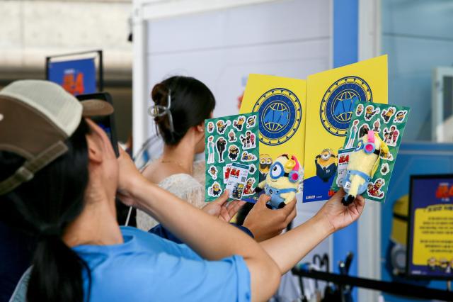 Visitors take a photo at the Design Vibes A Despicable Me Summer Vacation at Dongdaemun Design Plaza in Seoul on July 24 2024 AJU PRESS Kim Dong-woo