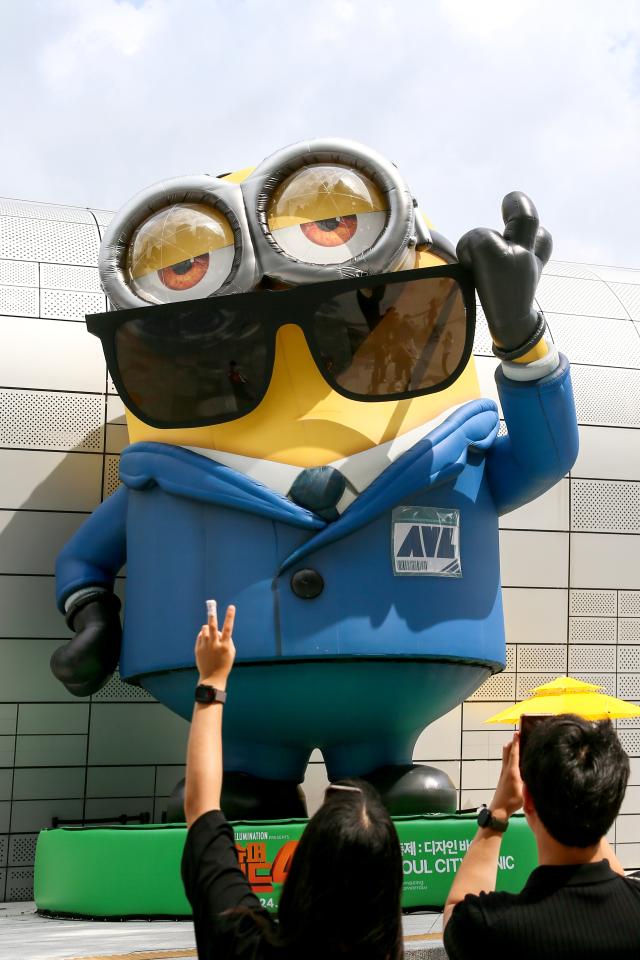 Visitors take a photo at the Design Vibes A Despicable Me Summer Vacation at Dongdaemun Design Plaza in Seoul on July 24 2024 AJU PRESS Kim Dong-woo