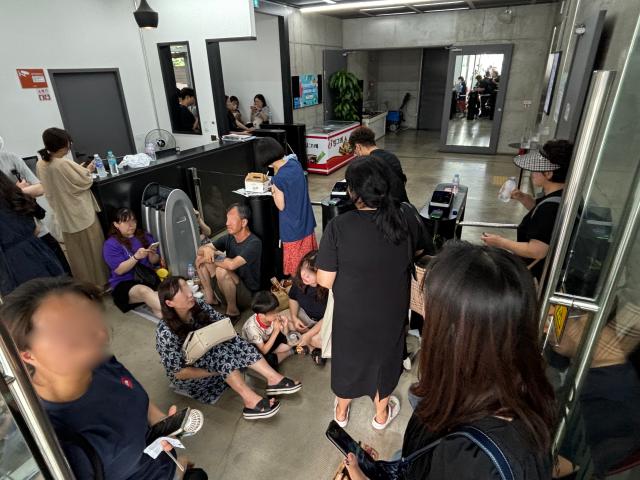 People wait for refunds at WeMakePrice headquarters in Gangnam-gu Seoul July 25 2024 AJU PRESS Han Jun-gu