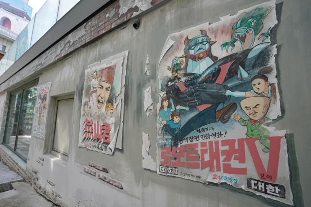 Vintage movie posters lined up inside Donuimun Museum Village in Jongno Seoul on July 26 2024 AJU PRESS Park Jong-hyeok