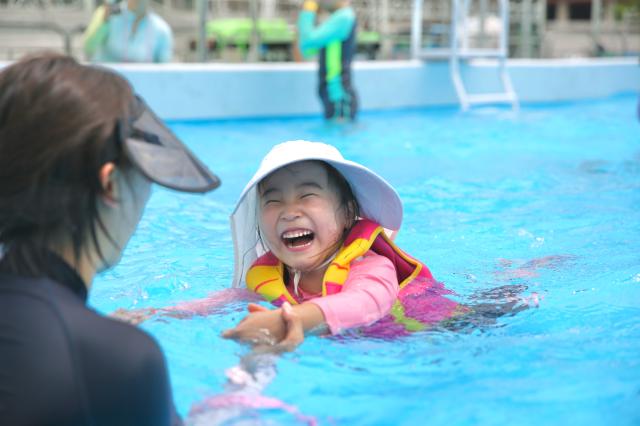 A kid swims with her mother at the 2024 Seoul Summer Beach in Gwanghwamun Square Seoul on July 26 2024 AJU PRESS Han Jun-gu