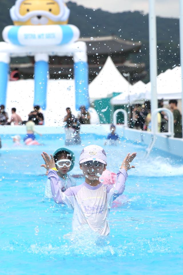 A kid sprays water at the 2024 Seoul Summer Beach in Gwanghwamun Square Seoul on July 26 2024 AJU PRESS Han Jun-gu