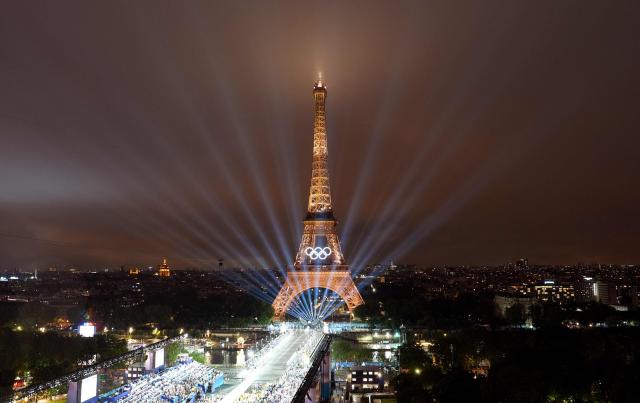 PHOTOS: Paris kicks off Olympics with outdoor spectacle despite glitches