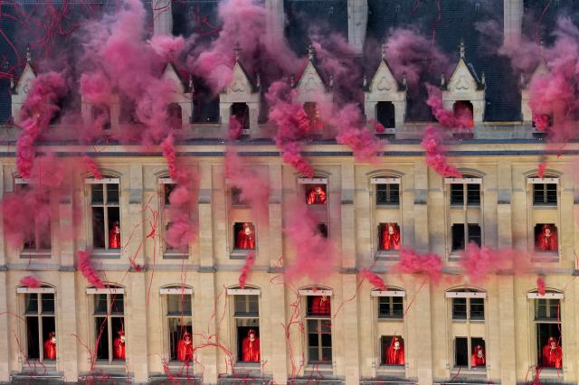 Smoke billows near windows as performers participate during the opening ceremony of the 2024 Summer Olympics Friday July 26 2024 in Paris France XinhuaYonhap