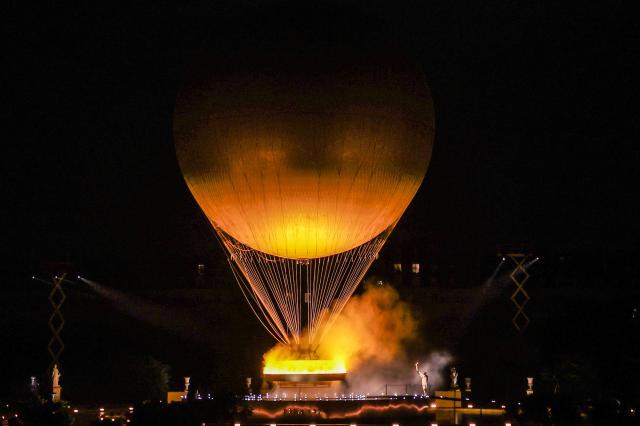 A hot air balloon lifts the cauldron during the Opening Ceremony of the Paris 2024 Olympic Games in Paris France 26 July 2024 EPAYonhap