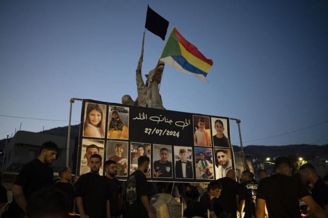 Photos of the children and teens killed in a rocket strike at a soccer field are displayed at a roundabout as people light candles in their memories at the village of Majdal Shams in the Israeli-annexed Golan Heights on July 28 2024 A rocket strike at a soccer field in the village has killed at least 12 children and teens Its the deadliest strike on an Israeli target along the countrys northern border since the fighting between Israel and the Lebanese militant group Hezbollah began  AP-Yonhap