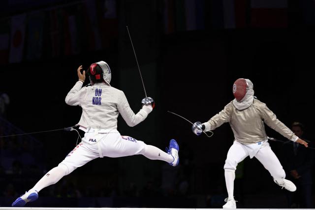 South Korean Oh Sang-uk and Tunisias Fares Ferjani compete in the mens sabre individual gold medal bout during the Paris 2024 Olympic Games at the Grand Palais in Paris on July 27 2024 AFP-Yonhap