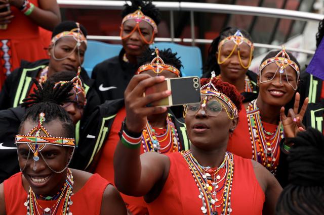 Athletes from various countries capturing moments with Galaxy Z Flip6 Olympic Edition phones during the 2024 Paris Olympics opening parade Courtesy of Samsung