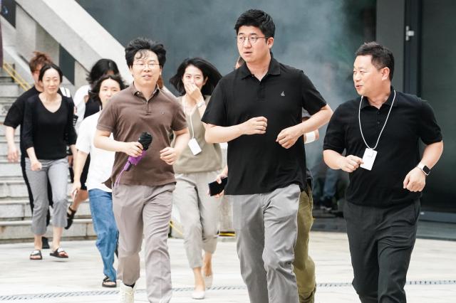 Citizens participate in an evacuation drill during Seouls earthquake response drill at Sejong Center for the Performing Arts next to Gwanghwamun Plaza on July 29 2024 AJU PRESS Park Jong-hyeok