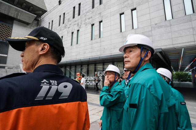 Firefighters and Seoul city officials inspect the site during an earthquake response drill at Sejong Center for the Performing Arts next to Gwanghwamun Plaza on July 29 2024 AJU PRESS Park Jong-hyeok