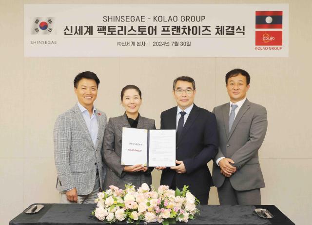 The image shows from left to right Park Sang-eon Shinsegae Factory Store MD Team Leader Chang Soo-jin Shinsegae Department Store Merchandising Director Lim Chan-gyu Mega Mall Living Goods Store Business General Manager and Roh Ki-ho Kolao Group BOG Business Operation  Growth General Manager Courtesy of Shinsegae