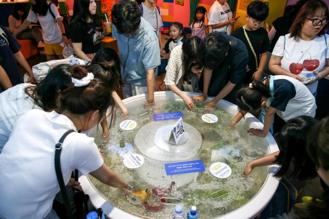 Visitors experience Dr Fish at the COEX Aquarium in Seoul on July 31 2024 AJU PRESS Kim Dong-woo