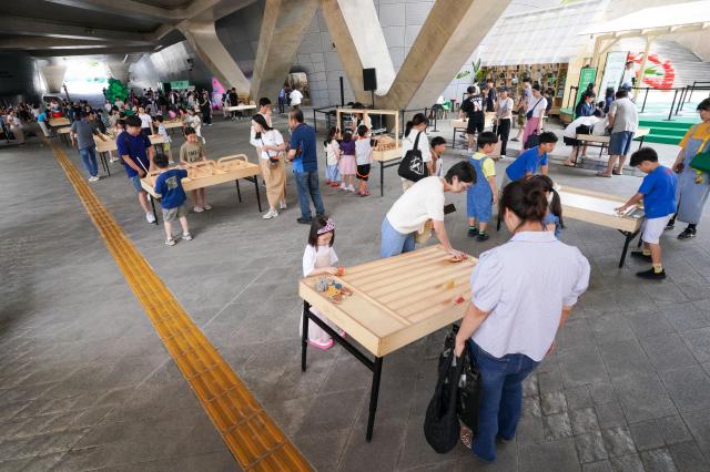 Visitors attend the 2024 Seoul City Picnic which opened on Aug 1 at the DDP in Seoul AJU PRESS Park Jong-hyeok