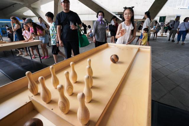 Children play wooden table games at the 2024 Seoul City Picnic which opened on Aug 1 at the DDP in Seoul AJU PRESS Park Jong-hyeok