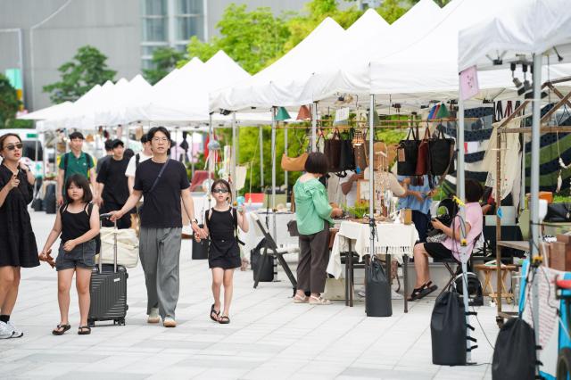 Visitors explore the design market at the 2024 Seoul City Picnic which opened on Aug 1 at the DDP in Seoul AJU PRESS Park Jong-hyeok