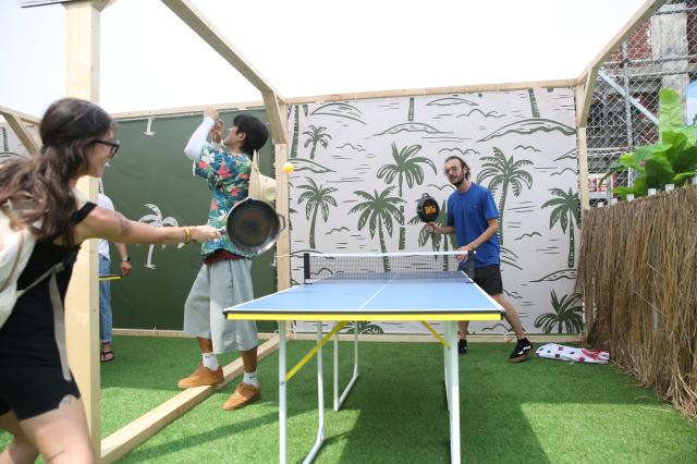 Visitors play table tennis with frying pans at the PUBG pop-up store PUBG Seongsu in Seongsu-dong Seoul on August 1 2024 AJU PRESS Han Jun-gu