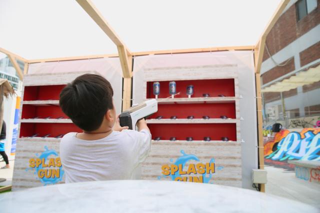 A child experiences shooting a water gun at the PUBG pop-up store PUBG Seongsu in Seongsu-dong Seoul on August 1 2024 AJU PRESS Han Jun-gu