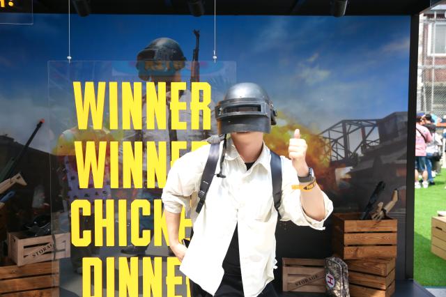 A visitor poses for a photo at the PUBG pop-up store PUBG Seongsu in Seongsu-dong Seoul on August 1 2024 AJU PRESS Han Jun-gu