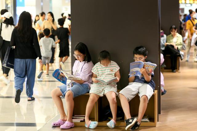 Children read books at Starfield Library in COEX Seoul on Aug 2 2024 AJU PRESS Kim Dong-woo