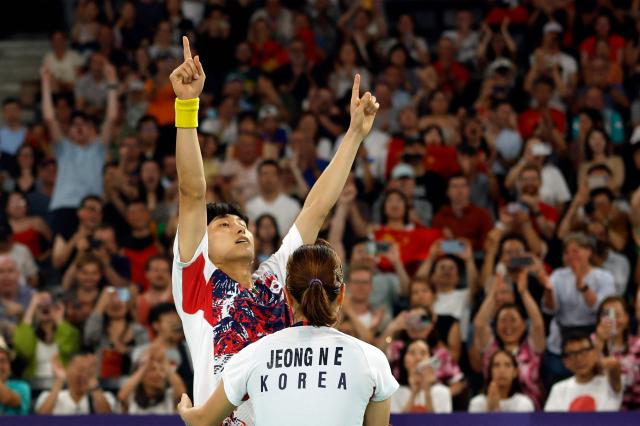 Jeong Na-eun embraces Kim Won-ho as they celebrate winning the mixed doubles badminton semi-final match against South Korea at the Paris Olympics in France on August 2 AFP-Yonhap