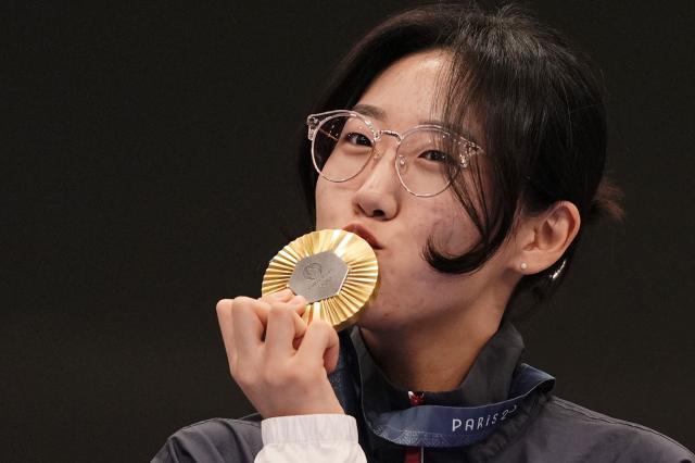 Shooter Yang Ji-in poses with her gold medal at the Summer Olympics in Paris France on Aug 3 Reuters-Yonhap
