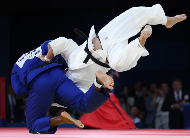 Korean judoka Kim Min-jong is thrown by Frances Teddy Riner at the Summer Olympics in Paris France on Aug 3 Yonhap