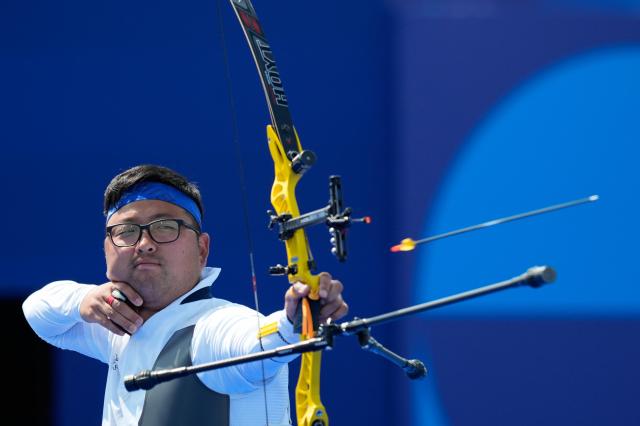 South Koreas Kim Woo-jin releases an arrow in his mens individual archery match at the 2024 Summer Olympics Sunday Aug 4 2024 in Paris France AP-Yonhap