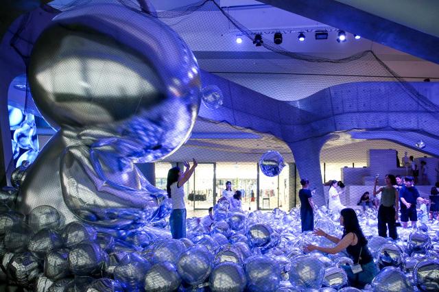 Visitors enjoy the Mega Boopoo event exhibition at Dongdaemun Design Plaza in Seoul on Aug 5 2024 AJU PRESS Kim Dong-woo