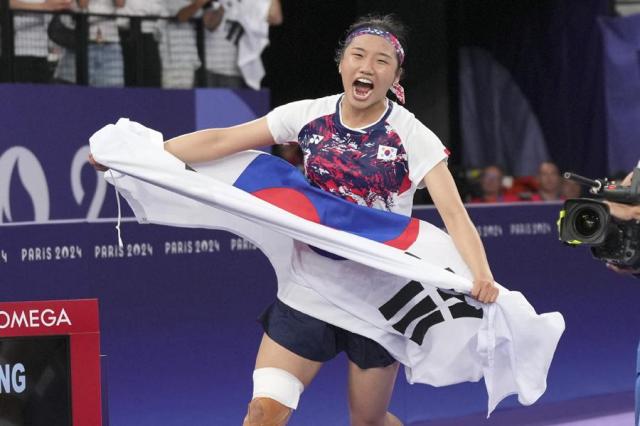 Badminton player An Se-young reacts after wining gold in the womens singles at the Summer Olympics in Paris France on Aug 5 2024 AP-Yonhap