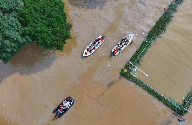 A rescue boat transporting flood victims in Guilin Guangxi Zhuang Autonomous Region China on June 20 Xinhua-Yonhap