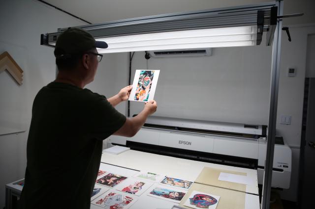 A printing industry worker inspects a printed work in Chungmuro Seoul on August 5 2024 AJU PRESS Han Jun-gu