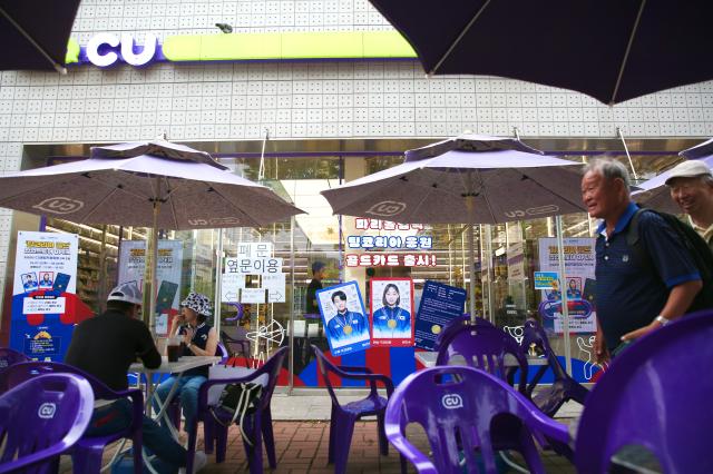 Advertisements related to the pop-up store are posted outside the CU convenience store at the gold pop-up store in Olympic Plaza Seoul on July 29 2024 AJU PRESS Han Jun-gu