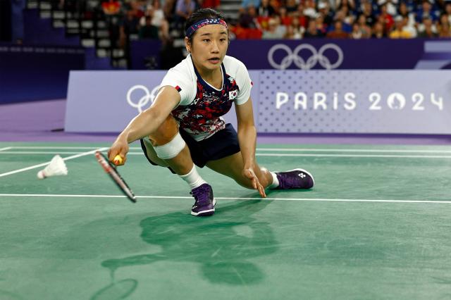 South Koreas An Se-young plays a shot to Chinas He Bing Jiao in their womens singles badminton final match during the Paris 2024 Olympic Games at Porte de la Chapelle Arena in Paris on August 5 2024 AFP-Yonhap