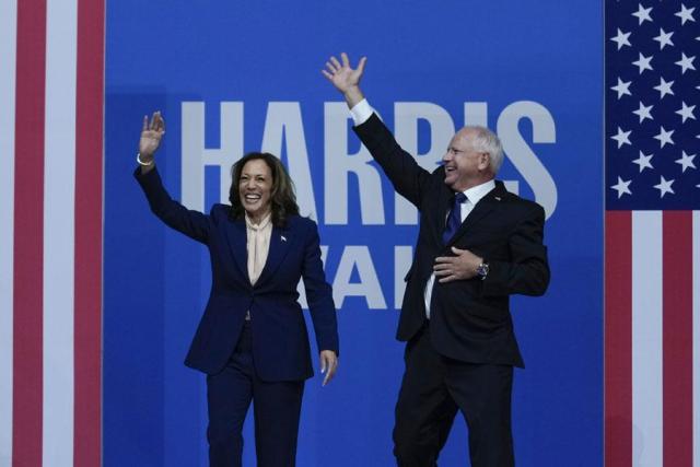 Democratic presidential nominee Vice President Kamala Harris and her running mate Minnesota Gov Tim Walz arrive at a campaign rally in Philadelphia on Aug 6 2024 AP-Yonhap