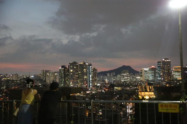 People enjoy the night view in Haebangchon Yongsan Seoul on August 6 2024 AJU PRESS Han Jun-gu