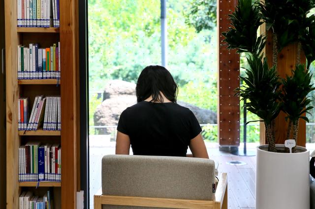 A visitor reads a book at Odong Public Library in Seongbuk-gu Seoul on Aug 7 2024 AJU PRESS Kim Dong-woo