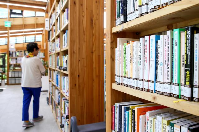 A visitor selects a book at Odong Public Library in Seongbuk-gu Seoul on Aug 7 2024 AJU PRESS Kim Dong-woo