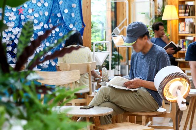 Visitors read books at Odong Public Library in Seongbuk-gu Seoul on Aug 7 2024 AJU PRESS Kim Dong-woo