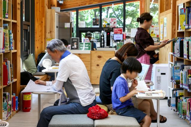 Visitors read books at Odong Public Library in Seongbuk-gu Seoul on Aug 7 2024 AJU PRESS Kim Dong-woo