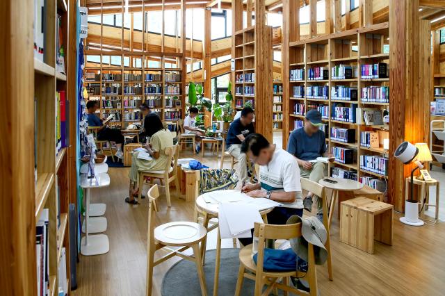 Visitors read books at Odong Public Library in Seongbuk-gu Seoul on Aug 7 2024 AJU PRESS Kim Dong-woo