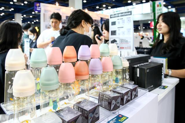 Visitors examine childcare products at the Global Baby Fair held at COEX in Seoul on Aug 8 2024 AJU PRESS Kim Dong-woo