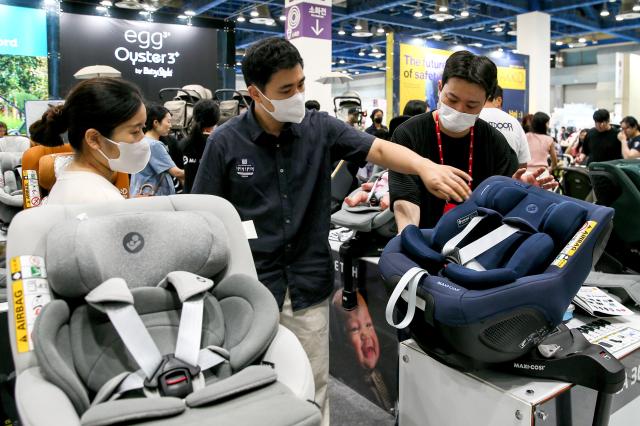 Visitors examine car seats at the Global Baby Fair held at COEX in Seoul on Aug 8 2024 AJU PRESS Kim Dong-woo